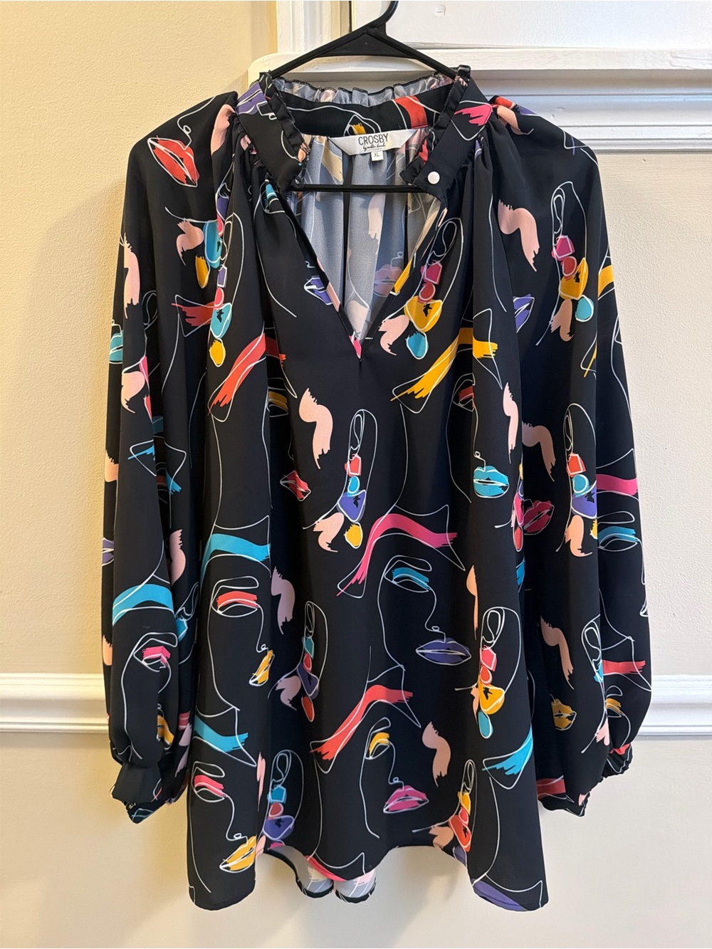Crosby by Mollie Burch V Neck Black Abstract Face Print V-Neck Blouse